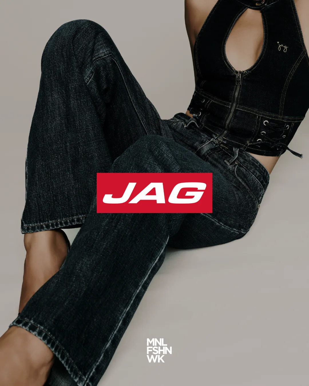 JAG campaign model in dark indigo denim with the brand's red anniversary mark