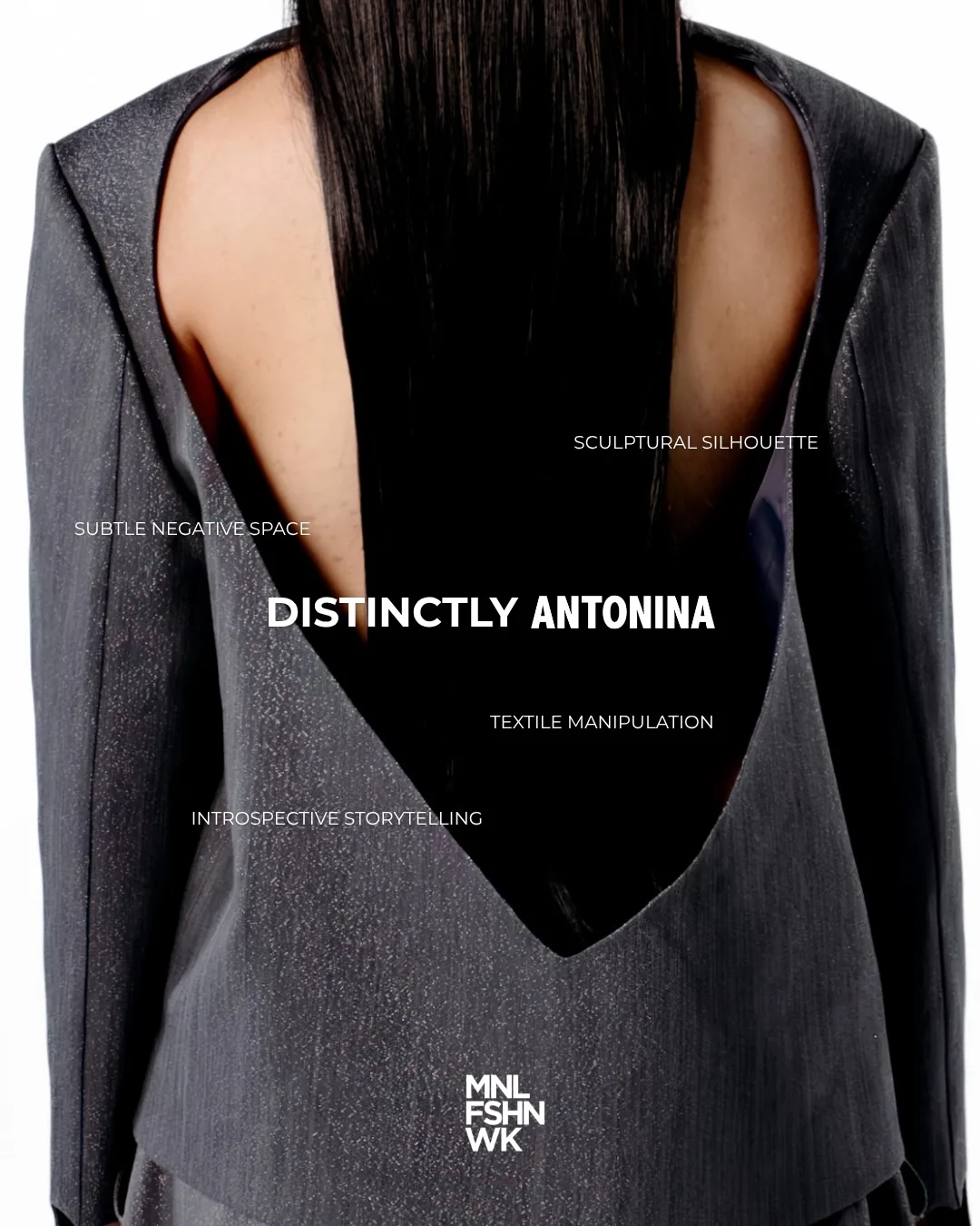 Close view of a sculptural grey Antonina blouse with a deep V cutout across the back