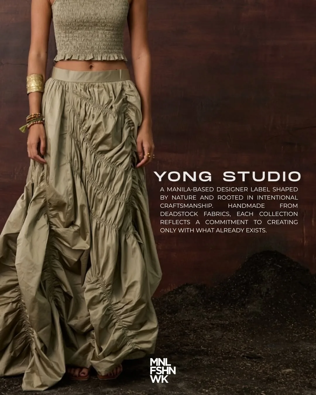 Ruched sage taffeta skirt and smocked top by Yong Studio photographed against dark earth