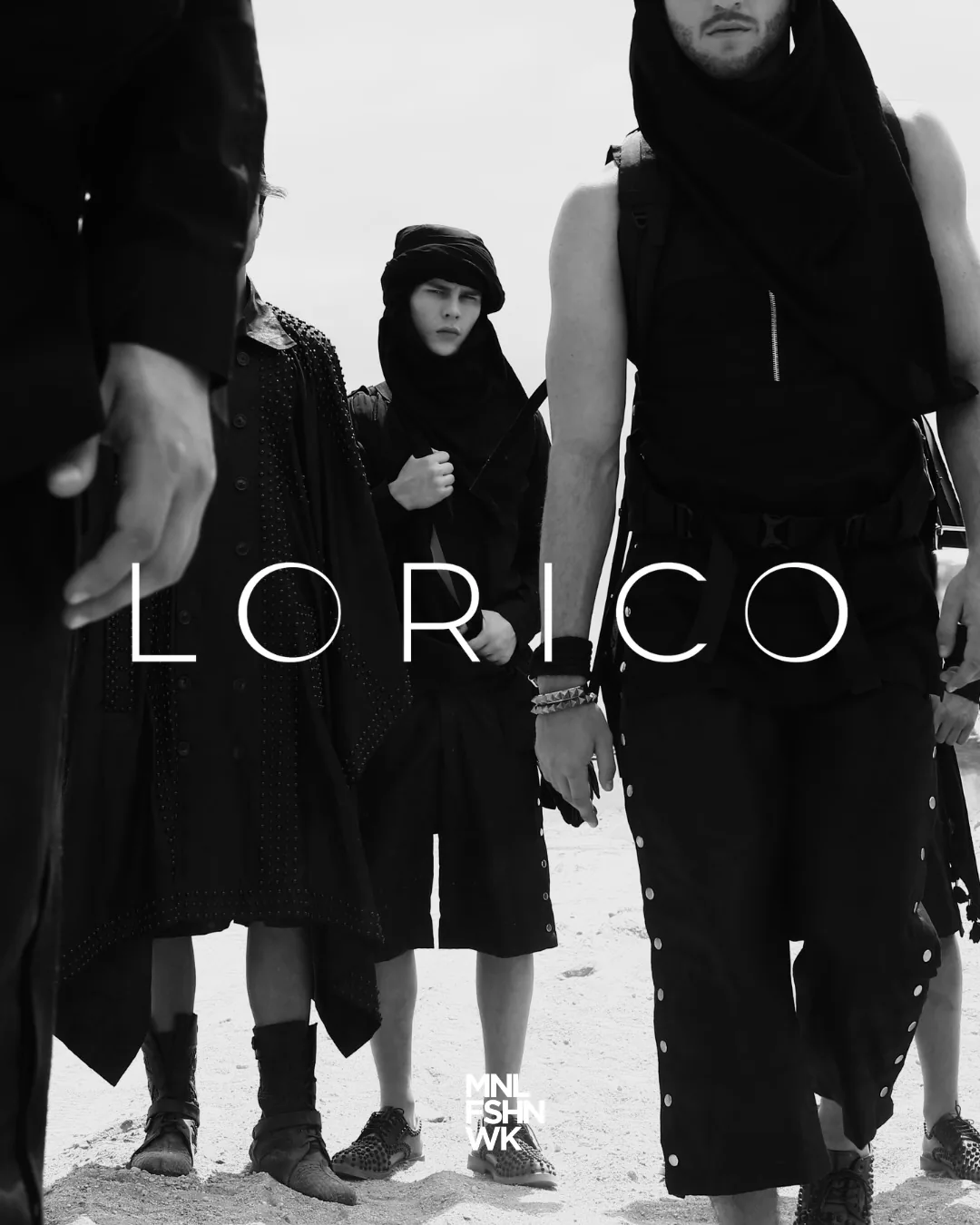 Lorico campaign portrait of models in layered black garments and wrapped headpieces